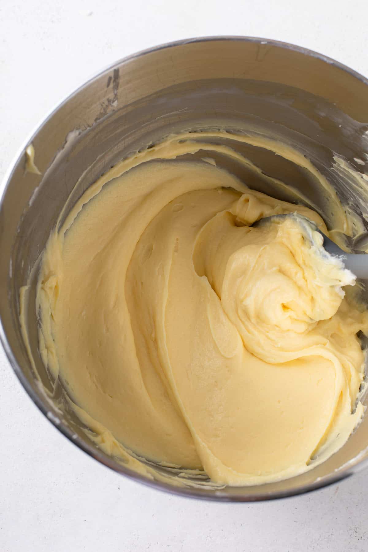 Pudding and cream cheese mixture beaten in a mixer bowl.