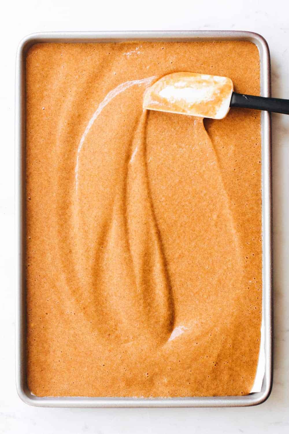 Pumpkin roll cake recipe complete with a dreamy cream cheese filling. The perfect fall dessert.