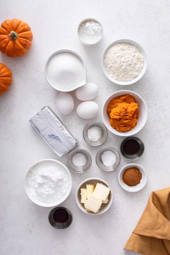 Pumpkin roll ingredients arranged on a countertop.