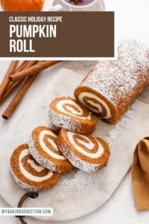 Pumpkin roll dusted with powdered sugar and sliced on a marble board. Text overlay includes recipe name.