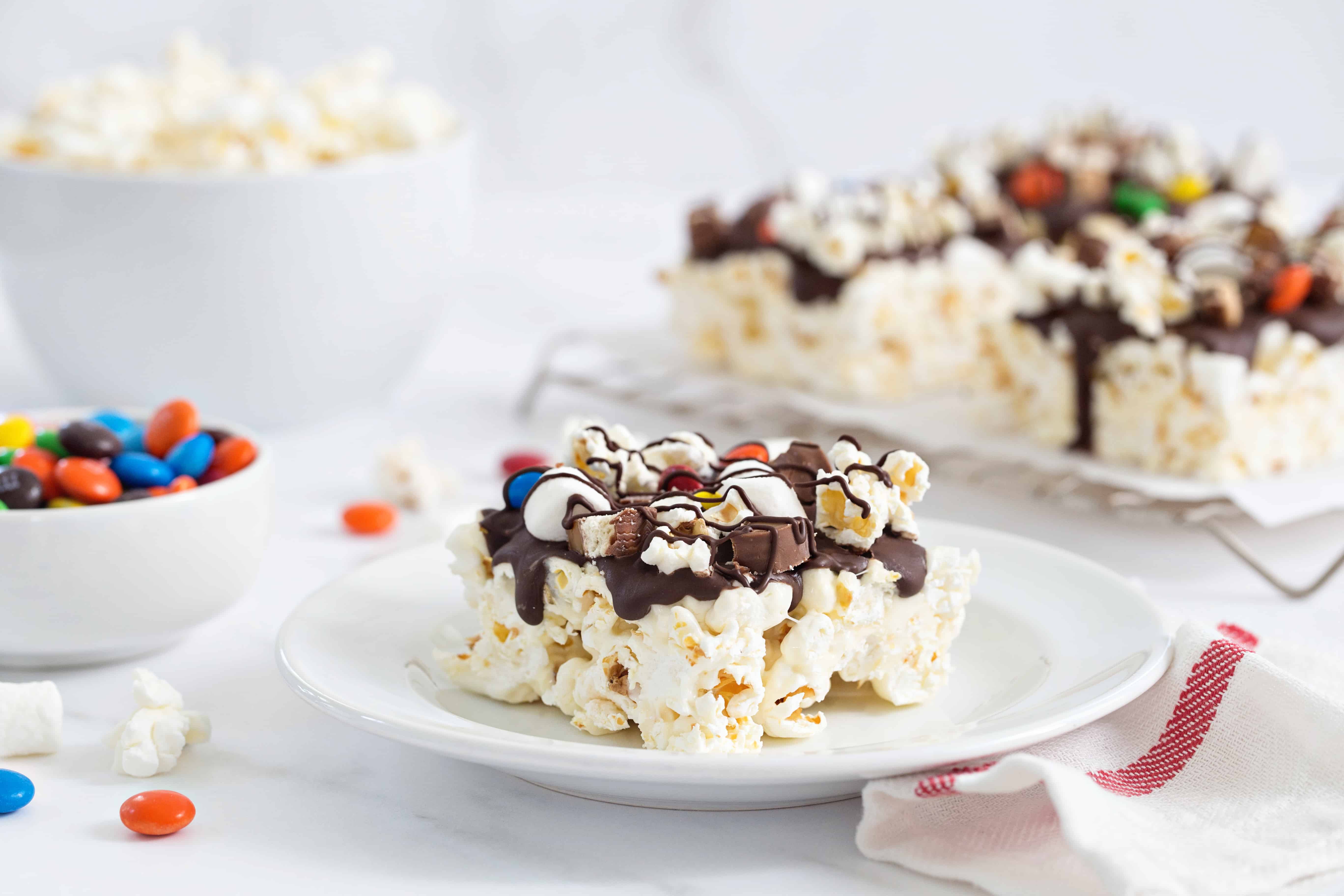 These Movie Theater Popcorn Bars are the perfect way to up your movie snack game. Top them with your favorite candy!