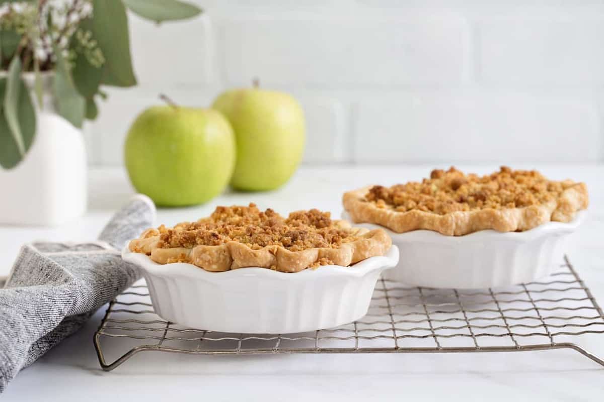 Mini Apple Pies are an individual twist on everyone’s favorite classic apple pie. Filled with caramel apple filling and topped with crumbs, these mini pies are sure to become one of your new favorites!