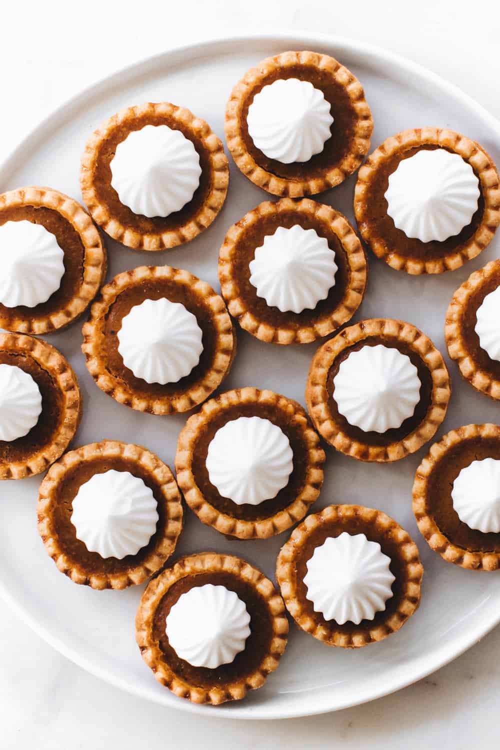 Mini Pumpkin Pies couldn't be more perfect for the holidays! They're simple and totally delish!