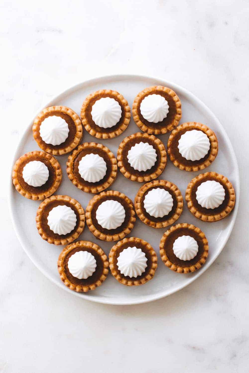 Mini Pumpkin Pies the perfect holiday dessert. Simple to make and fun to eat!
