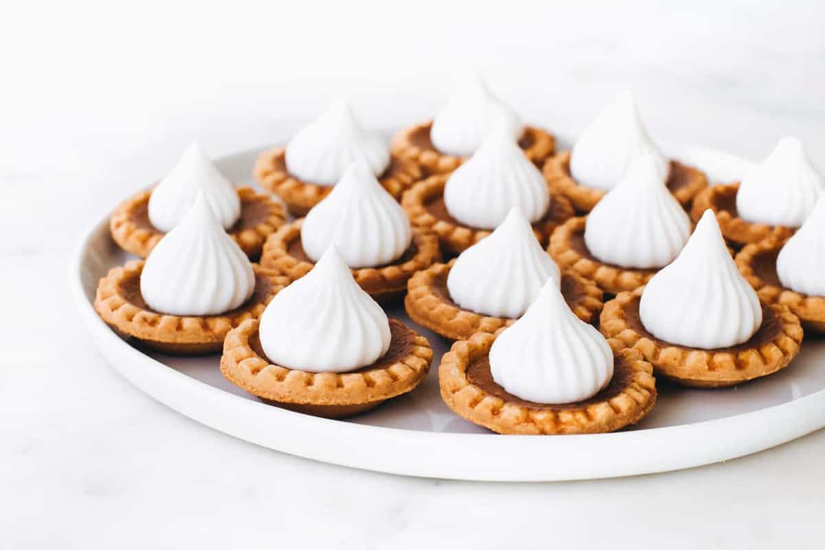 Mini Pumpkin Pies are a simple delicious fall dessert. Don't forget the dollop of whipped cream!