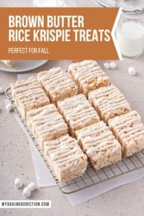 Sliced brown butter rice krispie treats, drizzled with icing, set on a wire cooling rack. Text overlay includes recipe name.
