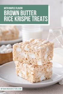 Two brown butter rice krispie treats stacked on a white plate. Text overlay includes recipe name.