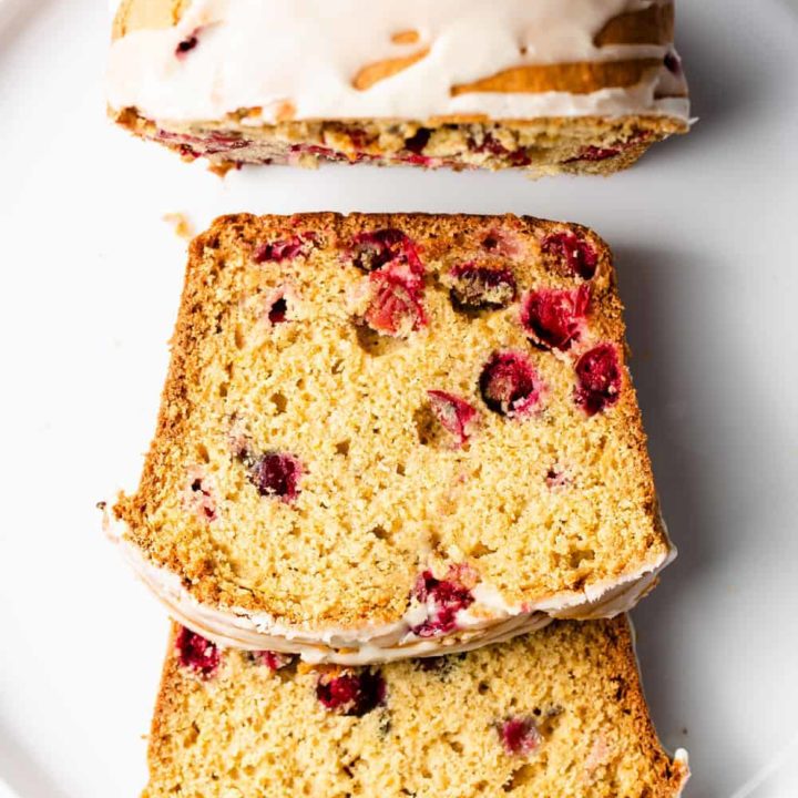 Cranberry Orange Bread is sweet, tart and bursting with fresh cranberries and the flavor of oranges. Perfect for breakfast or dessert!