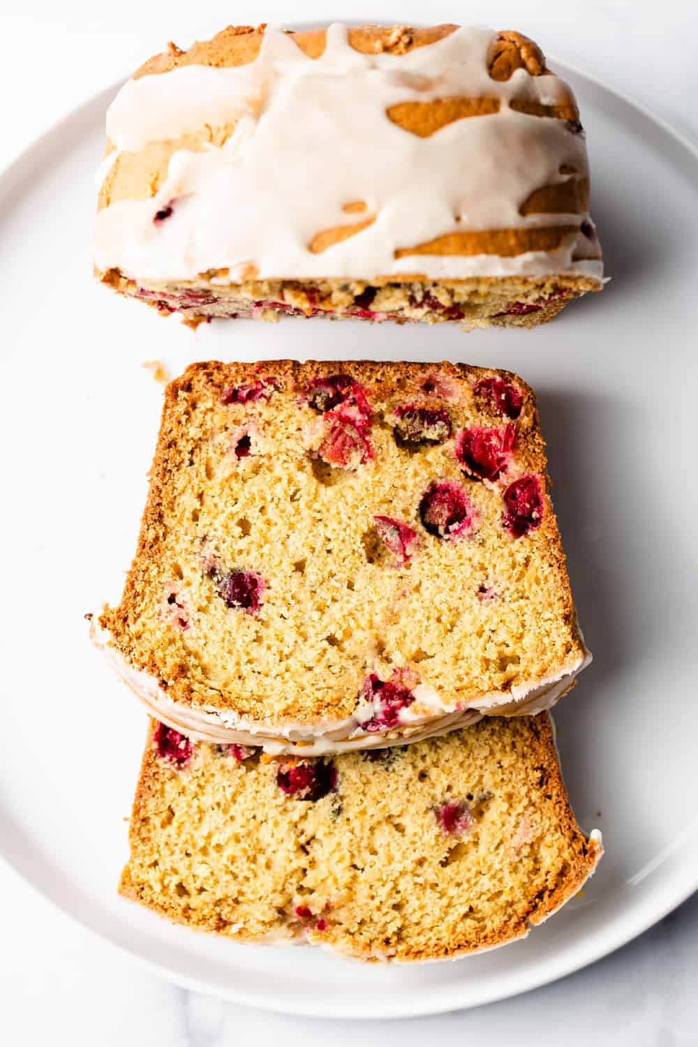 Cranberry Orange Bread is sweet, tart and bursting with fresh cranberries and the flavor of oranges. Perfect for breakfast or dessert!