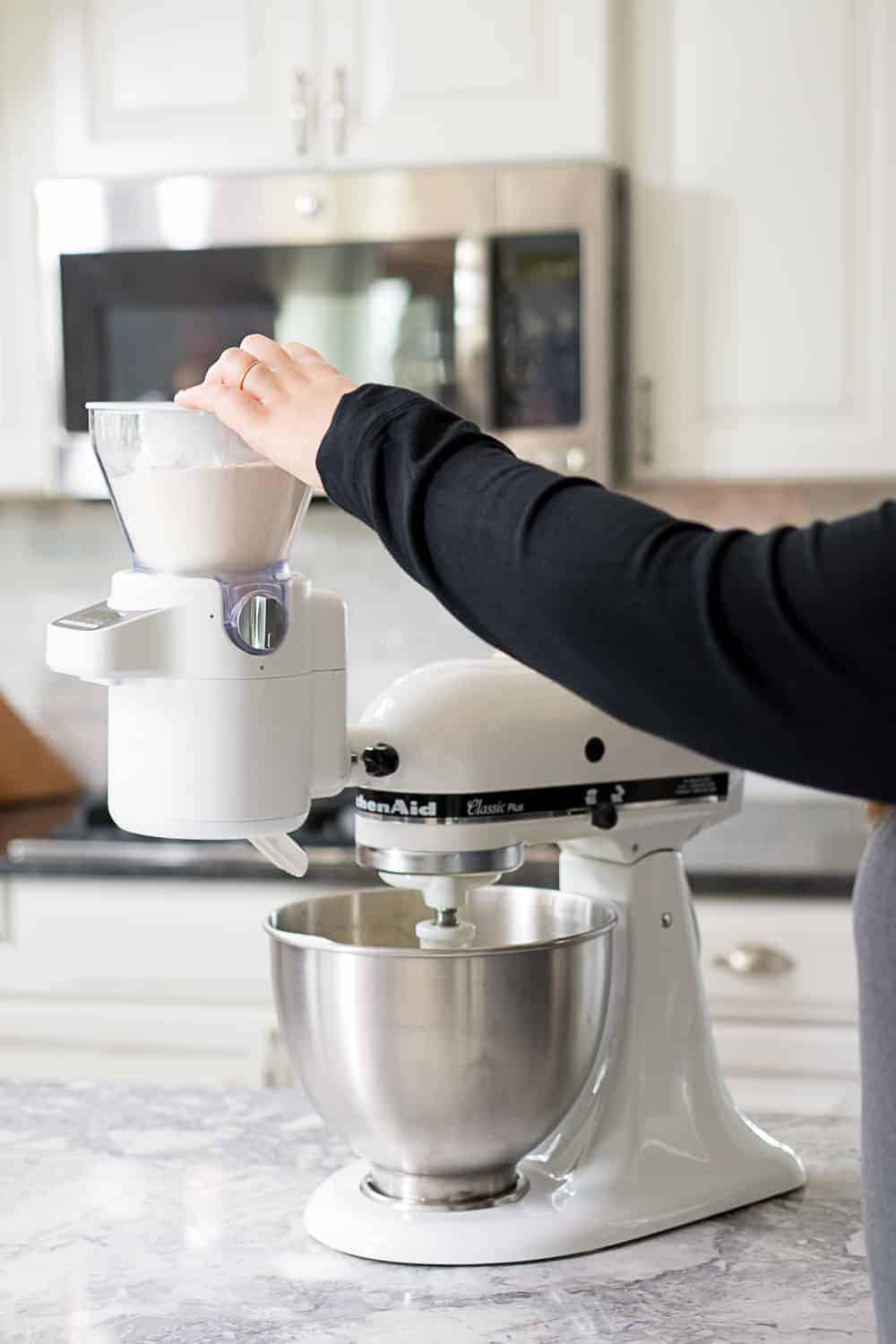 KitchenAid Sifter + Scale Attachement Lifetstyle photo in white kitchen.