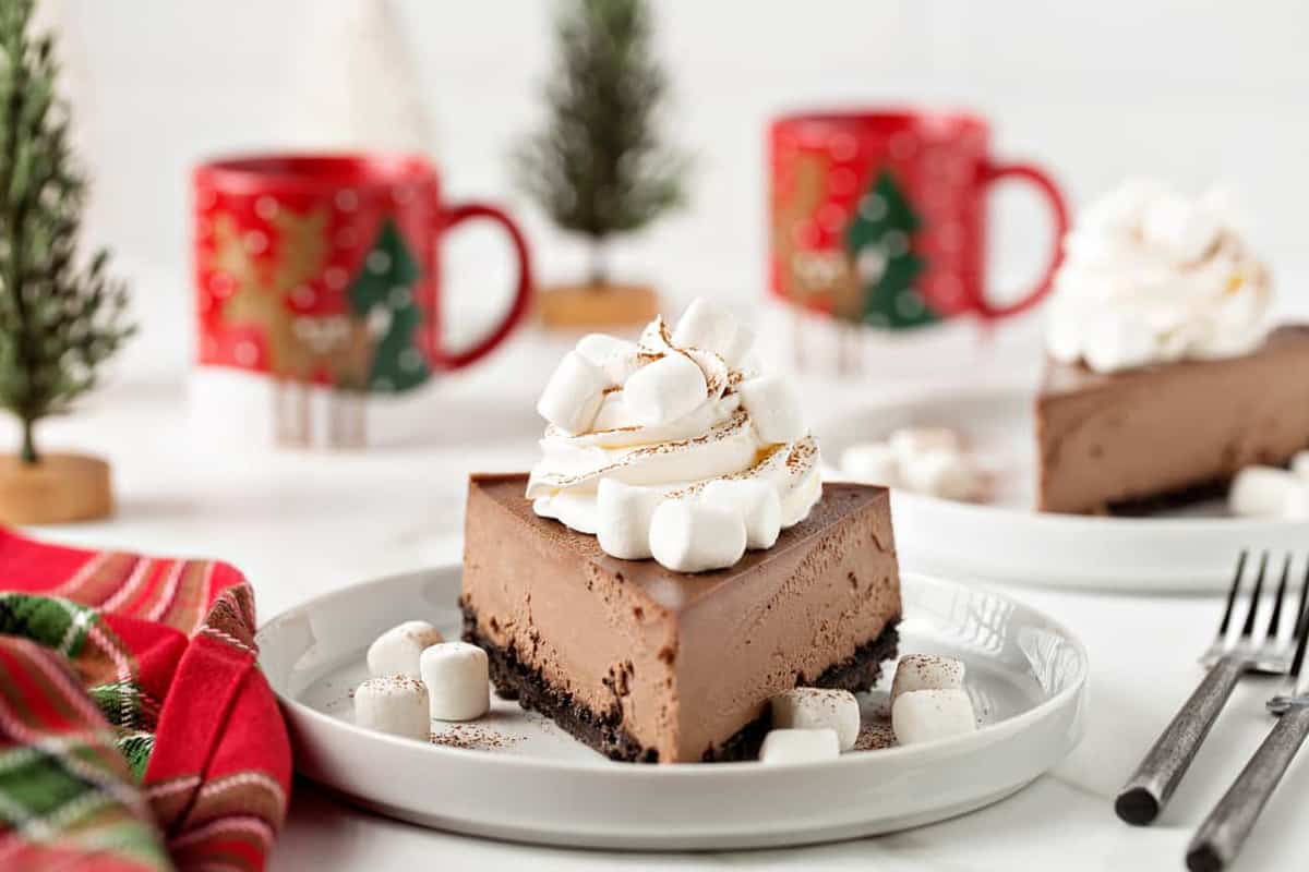 Hot Cocoa Cheesecake has all of the flavors of a cup of hot cocoa tucked into a rich, creamy cheesecake! You’ll love this cheesecake, right down to the mini marshmallows on top.