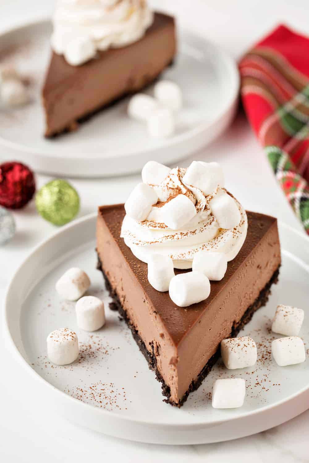 Hot Cocoa Cheesecake in bursting with hot cocoa flavor! You'll love every single festive bite!