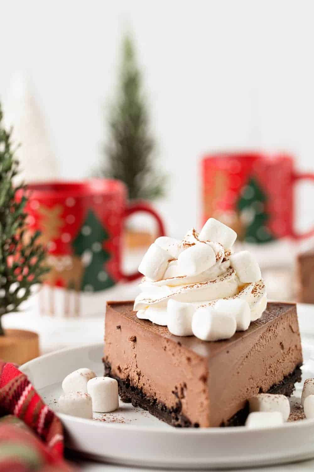 Hot Cocoa Cheesecake has all of the flavors of a cup of hot cocoa in a rich, creamy, chocolate cheesecake! You'll love everything about it, especially the fluffy marshmallows on top!