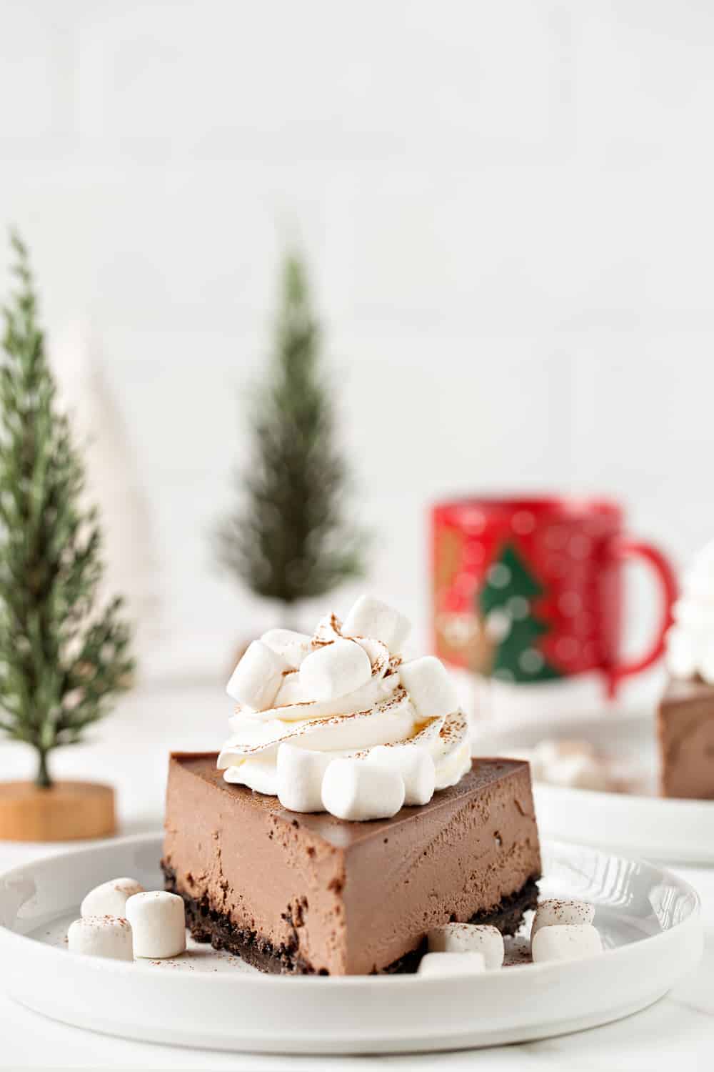 This Hot Cocoa Cheesecake is the perfect  dessert for any holiday party. Everyone will be begging you for the recipe!