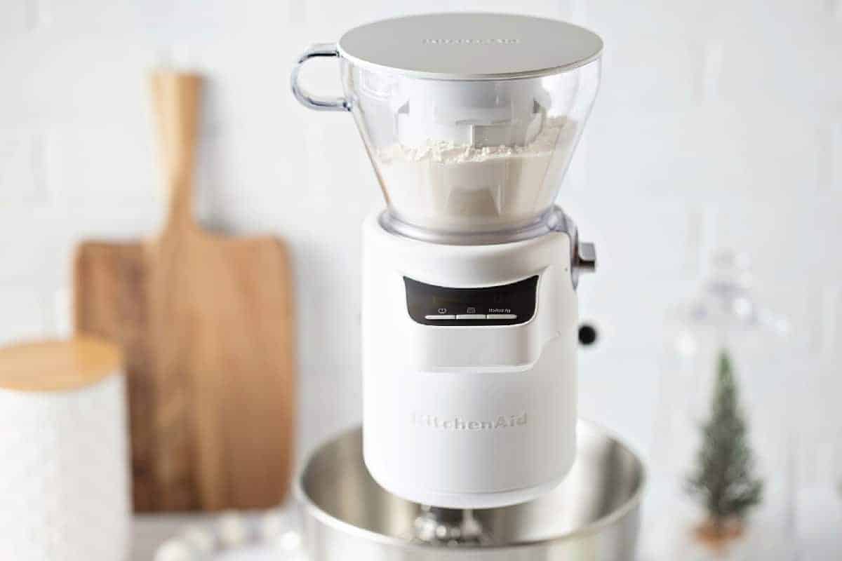 KitchenAid Sifter + Scale Attachment Image in white kitchen.