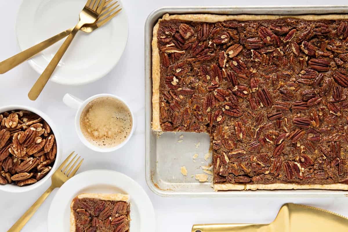 Pecan Slab Pie is going to be your new favorite Thanksgiving dessert. It's easy to make and feeds a crowd!