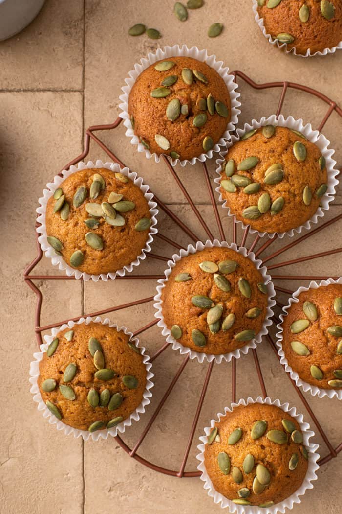 Overhead shot of pumpkin muffins cooling on a wire rack