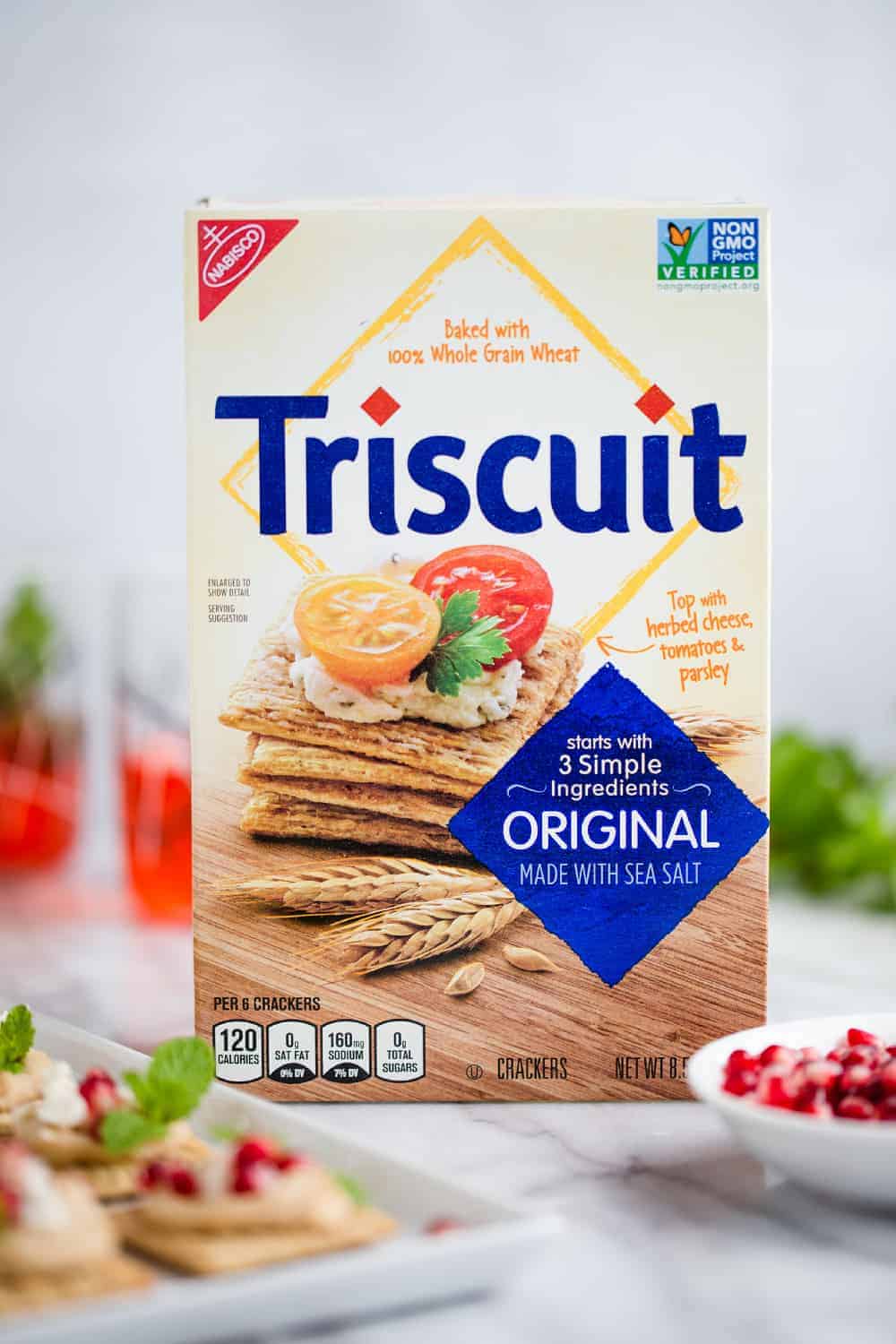 Hummus Pomegranate Triscuit Toppers take less than 5 minutes to whip up. They're simple, delicious and totally festive!