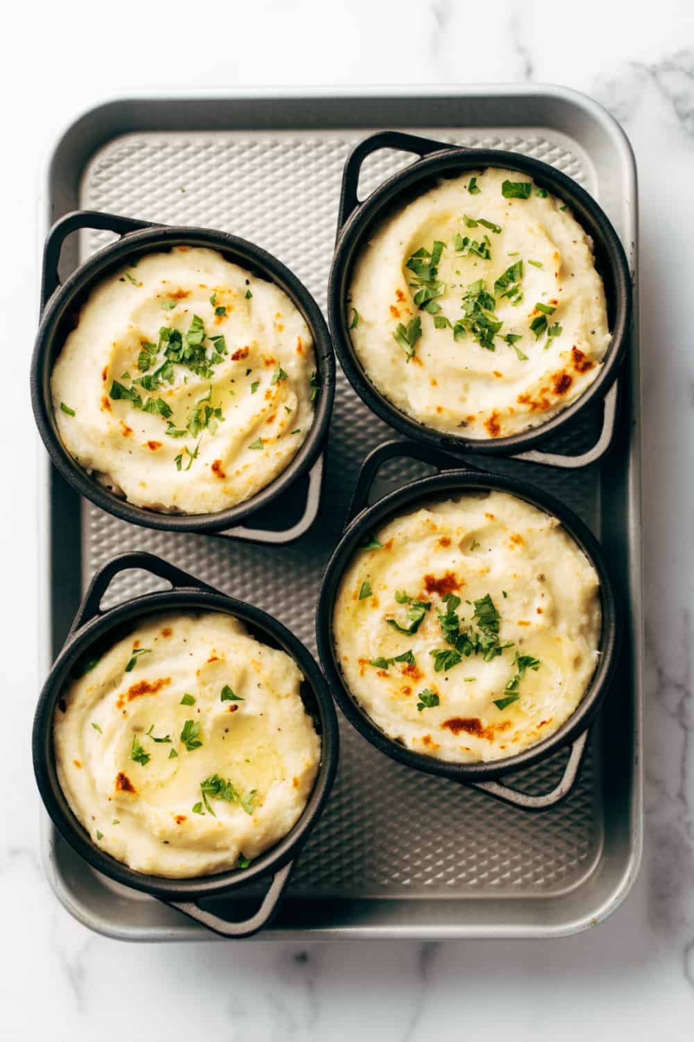 A topping of mashed potatoes and sprinkle of herbs are all you need to finish off Quick and Easy Shepherd's Pie