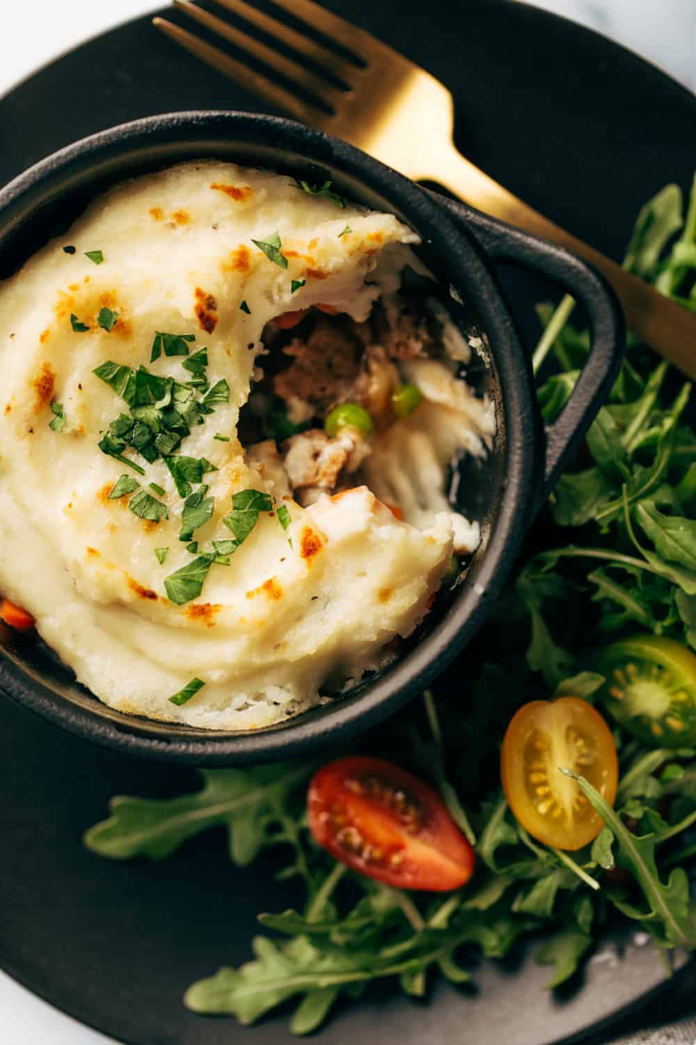 Layer mashed potatoes, salisbury steak, peas and carrots for Quick and Easy Shepherd's Pie