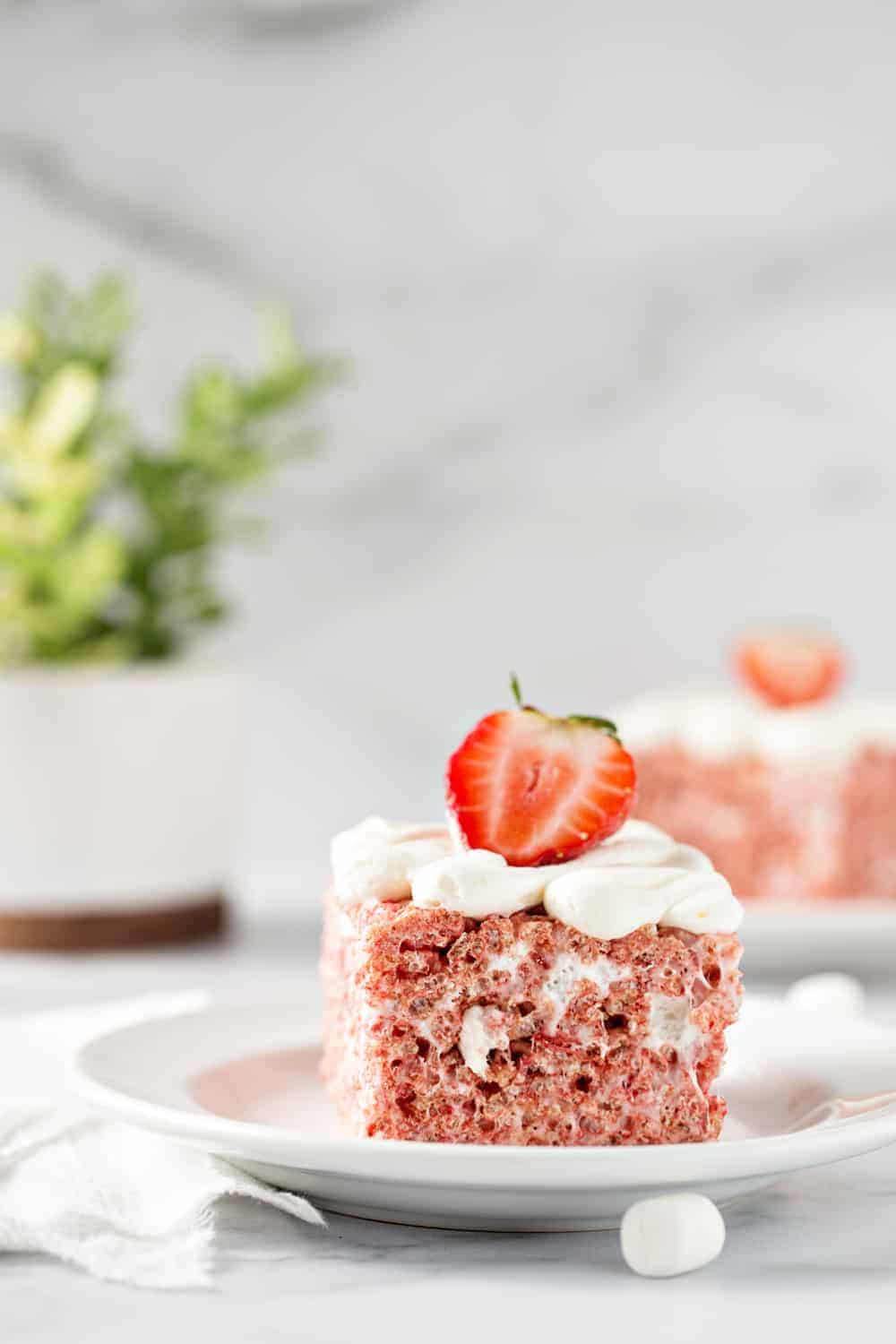 Strawberry Rice Krispie Treats are simple and totally delicious for spring! Ooey, gooey and loaded with strawberry flavor!