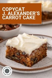 Slice of j alexander's carrot cake next to a fork on a plate, with a second plate of cake visible in the background. Text overlay includes recipe name.
