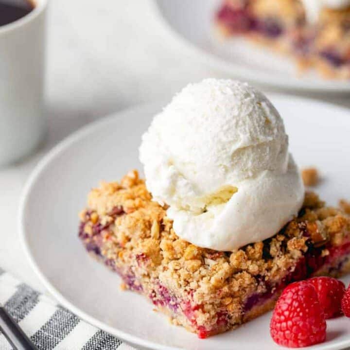 Top Berry Crumble Bars with a scoop of ice cream for a delicious spring dessert