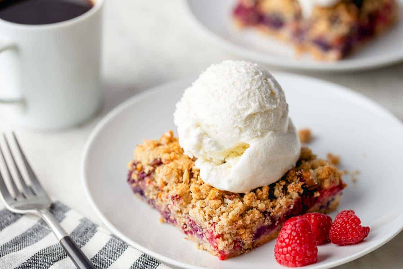 Top Berry Crumble Bars with a scoop of ice cream for a delicious spring dessert