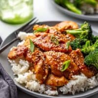 Honey Soy Chicken plated with broccoli on top of rice.