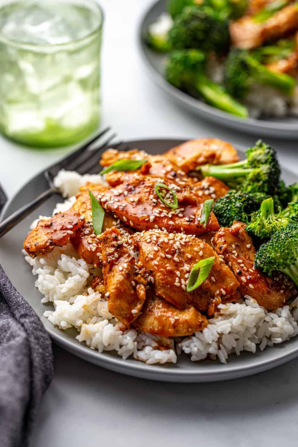 Honey Soy Chicken plated with broccoli on top of rice.