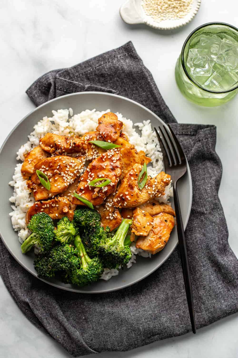 Overhead view of honey soy chicken and broccoli plated with rice