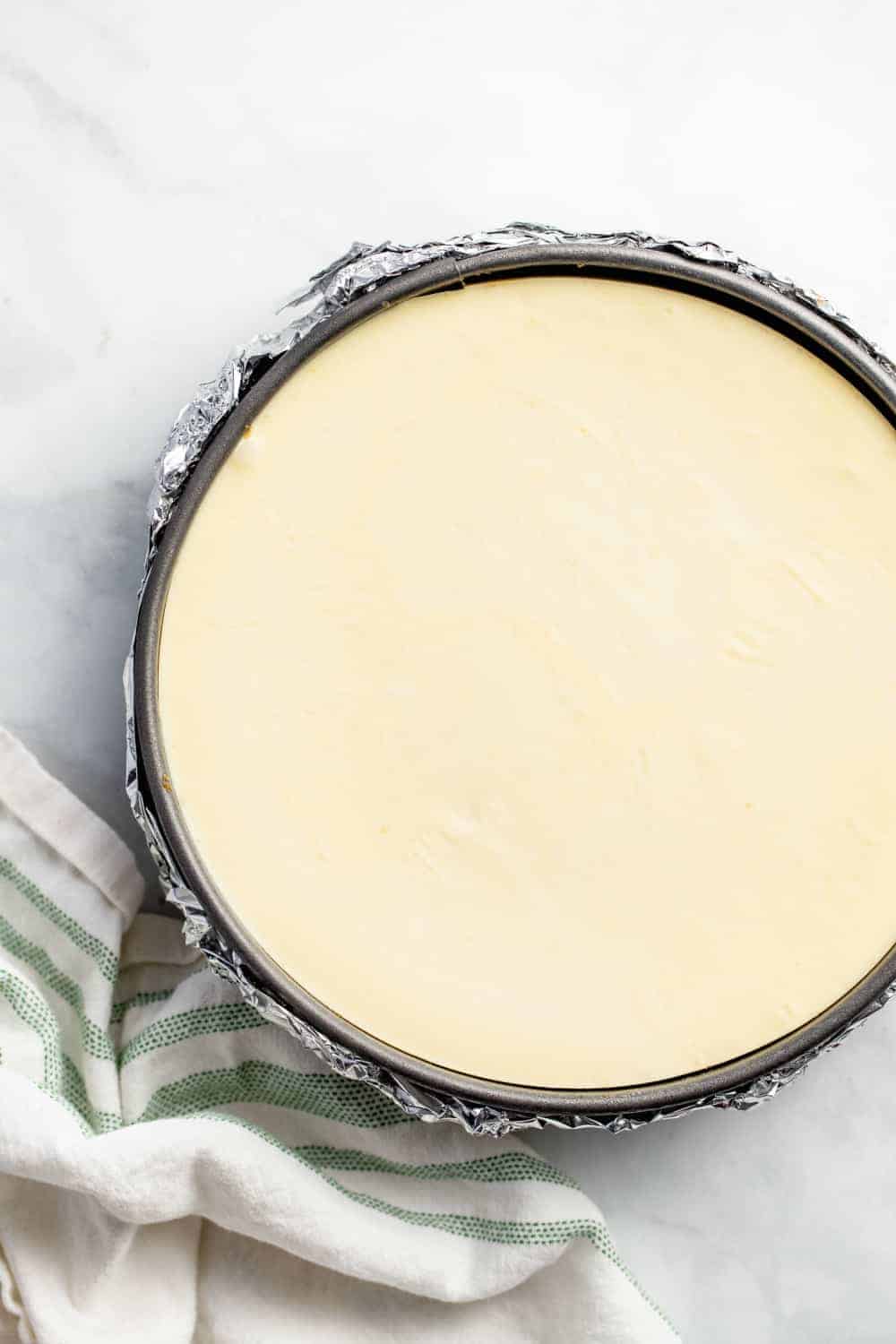 Overhead view of lemon cheesecake in a springform pan