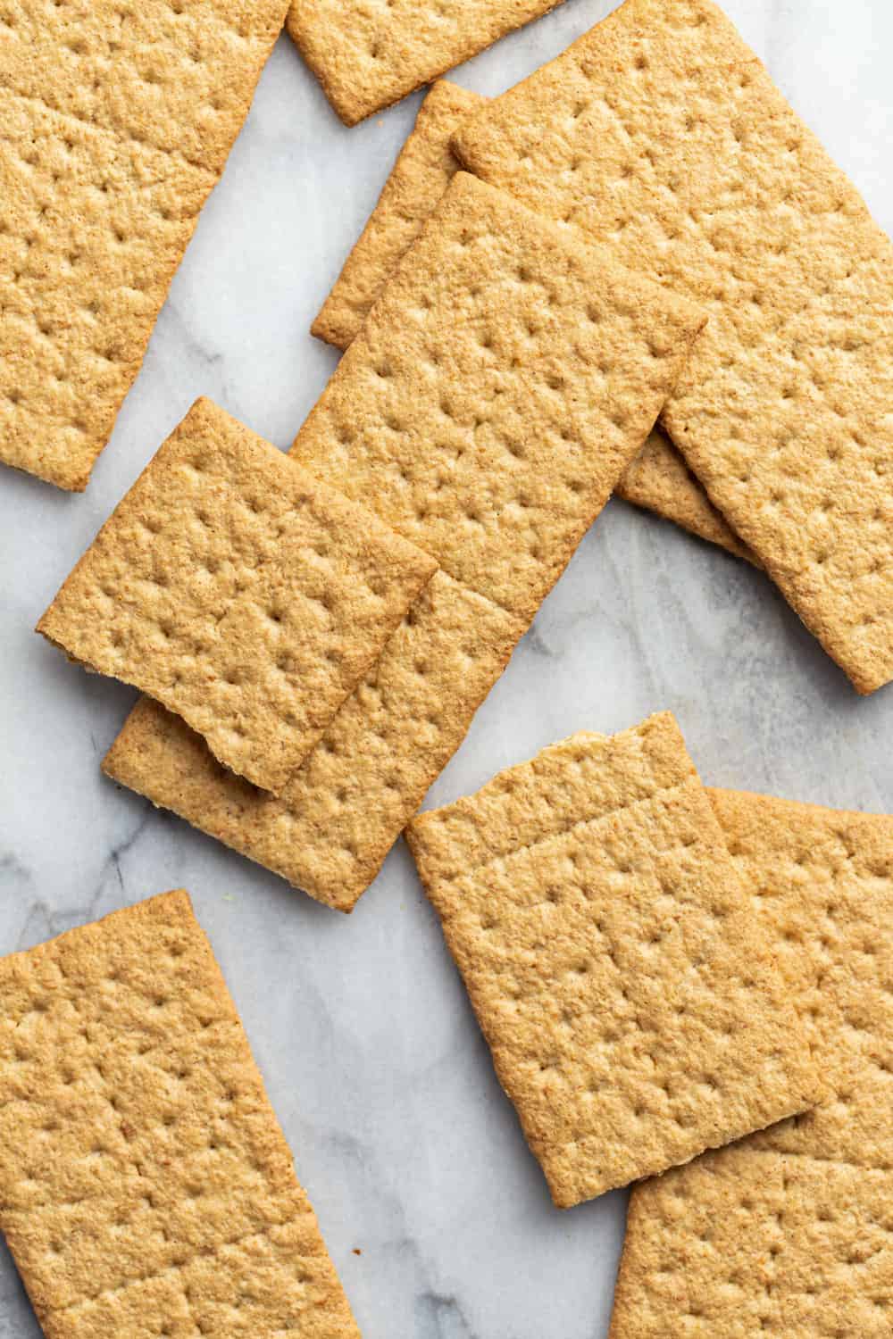 Whole graham crackers on a marble surface