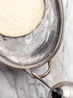 Adding boiling water to a roasting pan for a water bath