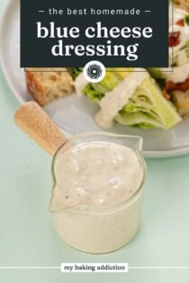 Glass jar for pouring salad dressing filled with blue cheese dressing. Text overlay includes recipe name.