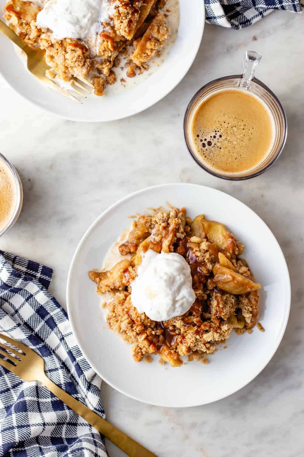 Plates of caramel apple crisp a la mode, ready to be served