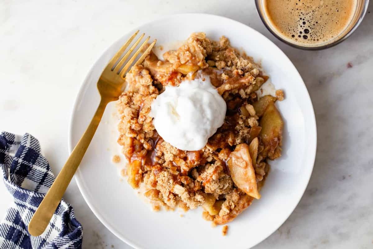 Overhead view of caramel apple crisp topped with ice cream