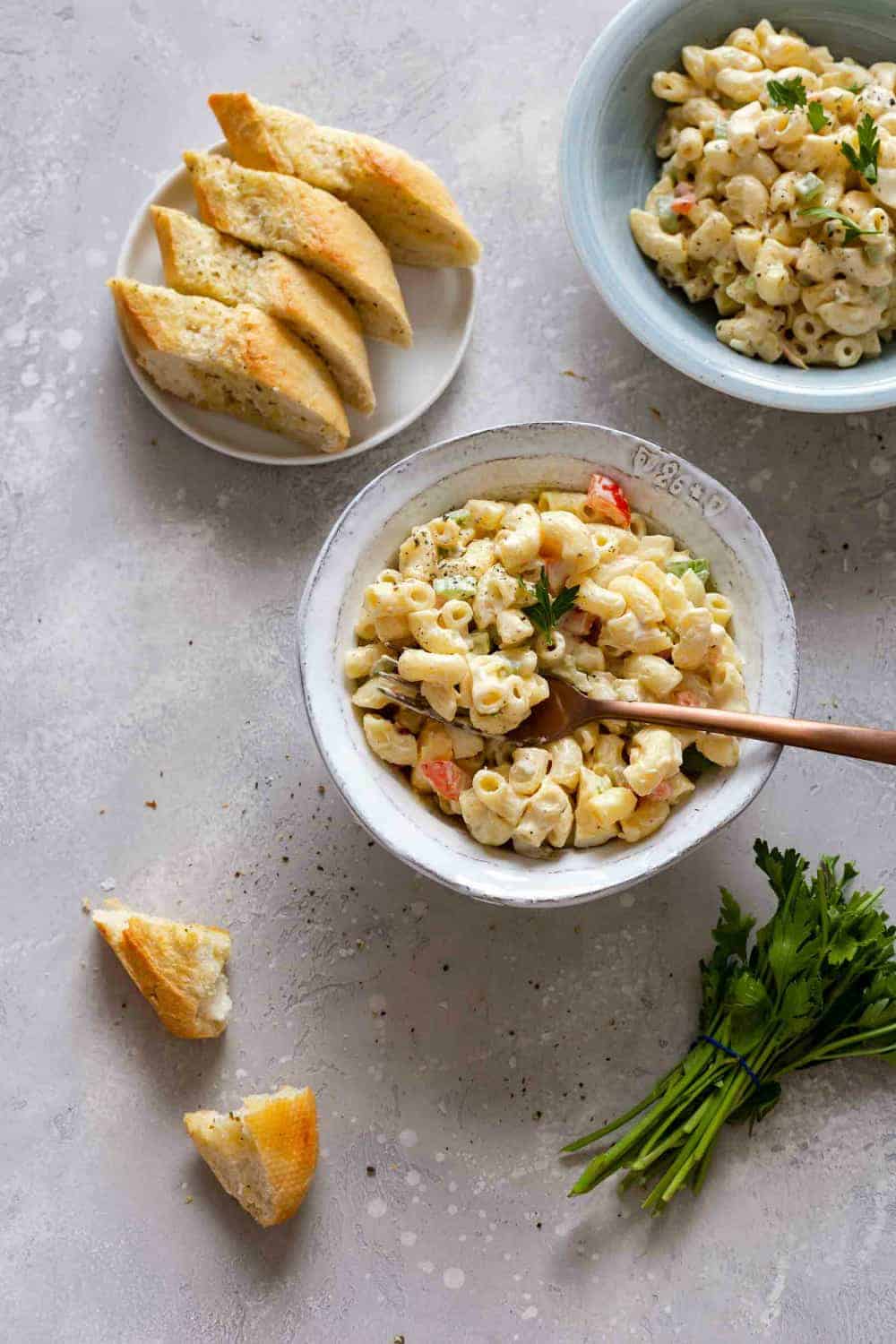 Bowl of macaroni salad with a fork in it