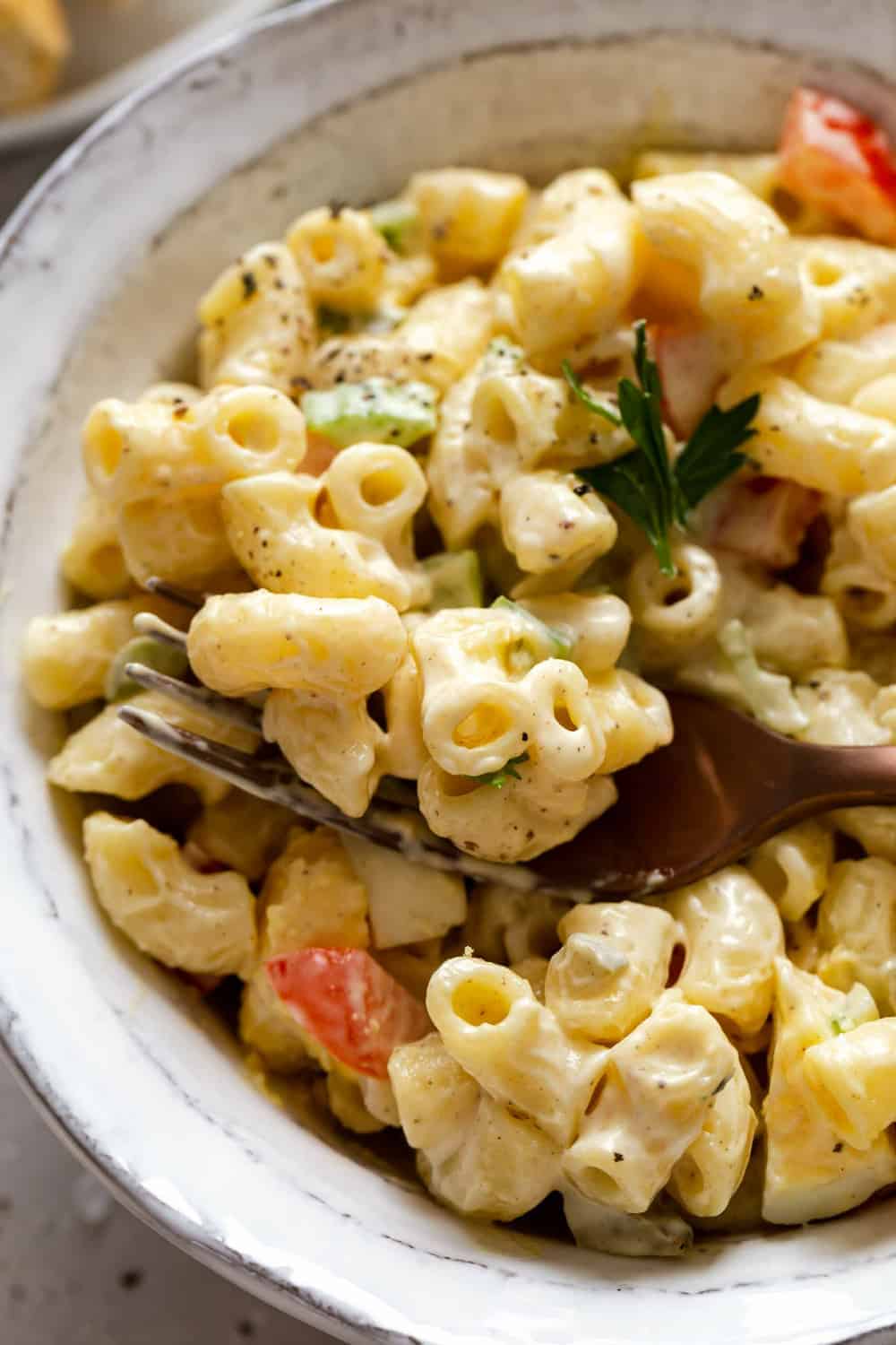 Overhead view of two bowls of macaroni salad