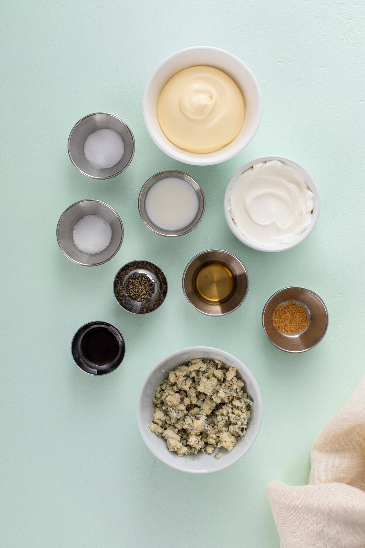 Ingredients for blue cheese dressing arranged on a countertop.