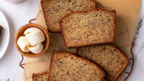 slices of dominique ansel's banana bread on a piece of parchment paper.