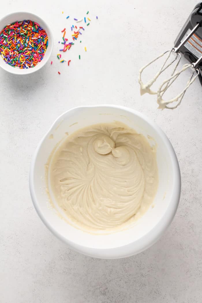 White cake batter base in a white mixing bowl.