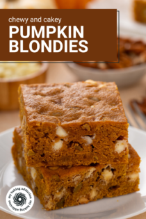 Two pumpkin blondies stacked on a white plate. Text overlay includes recipe name.