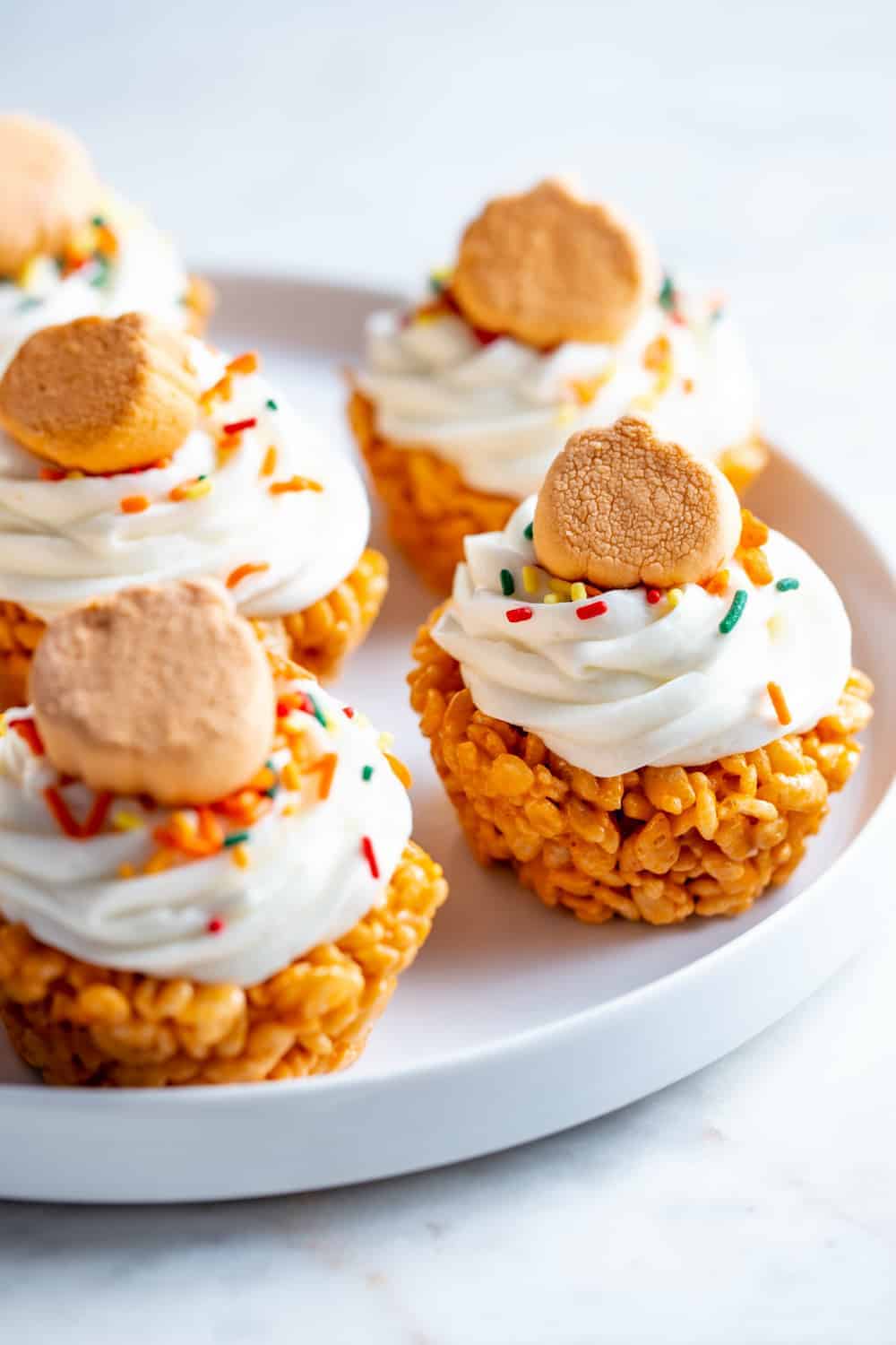 Platter of pumpkin spice marshmallow treat cupcakes
