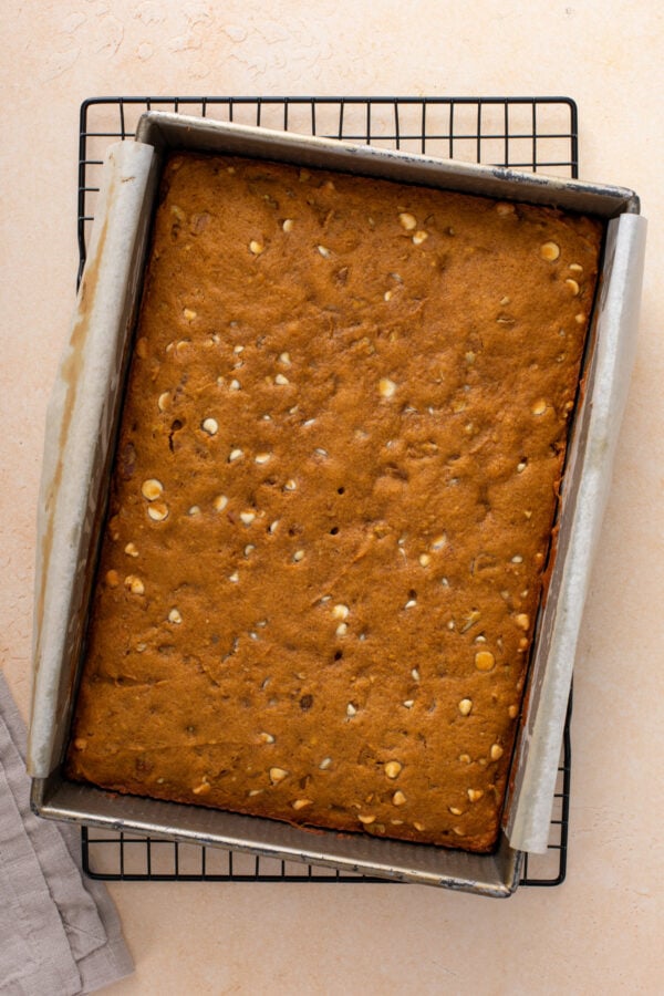 Overhead view of baked pumpkin blondies cooling in the pan.