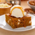 Pumpkin blondie topped with a scoop of ice cream.
