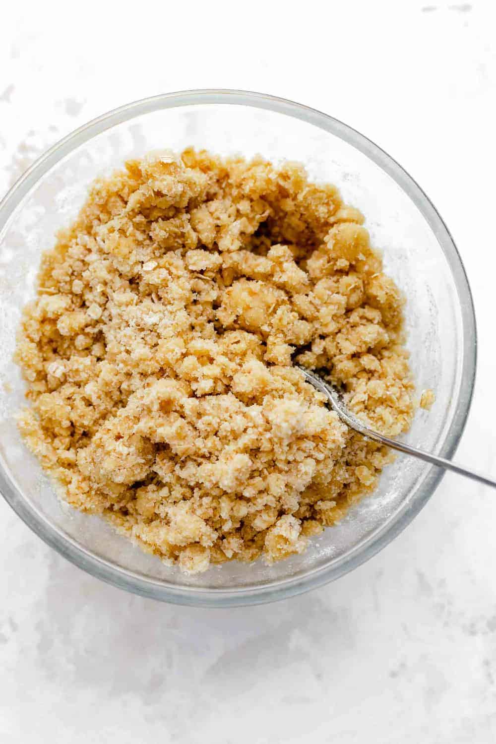 Crumble topping for apple crisp in a glass mixing bowl