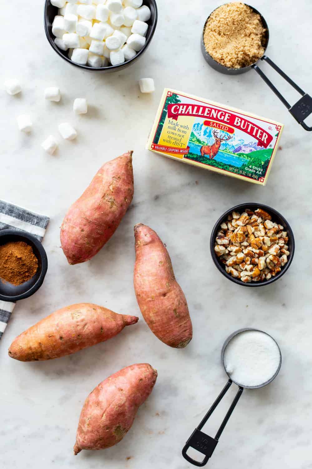 Ingredients for sweet potato casserole on a marble countertop
