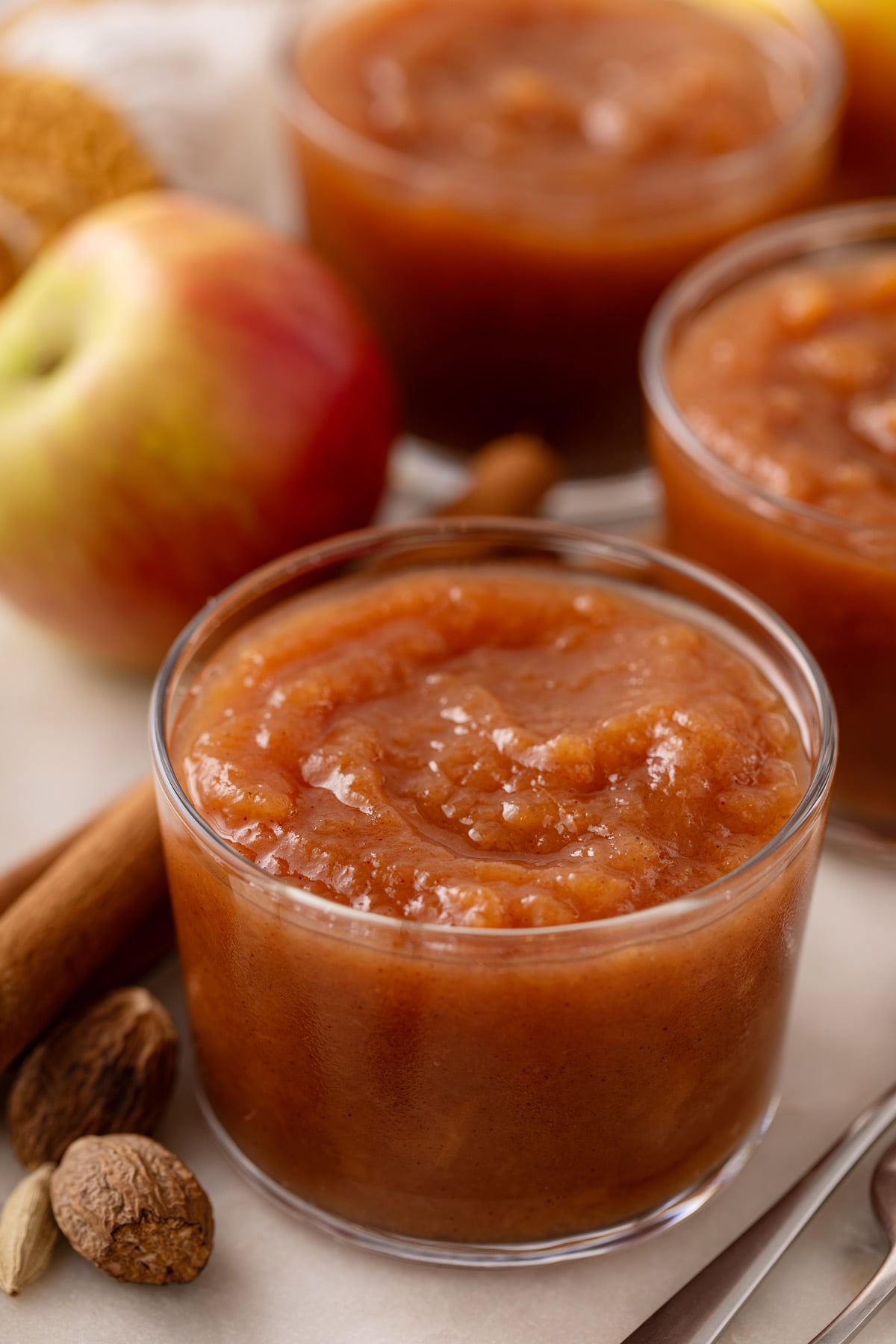 Crockpot applesauce in a small glass bowl.