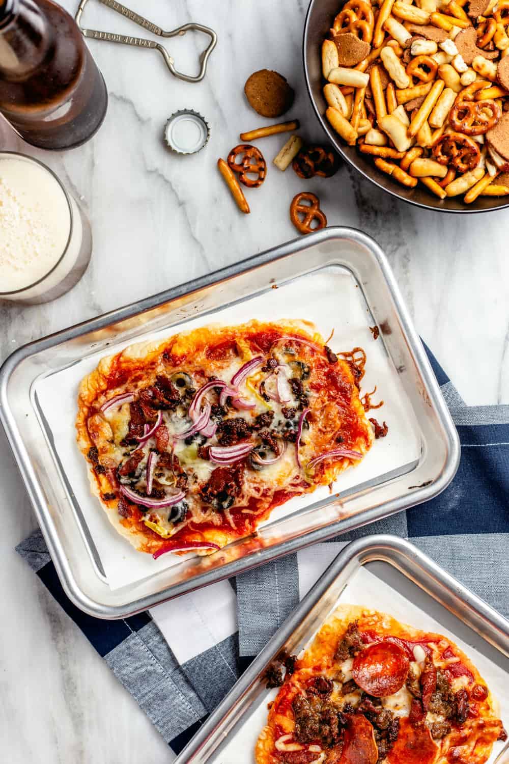 Baked individual pizzas from a DIY pizza bar on mini baking sheets